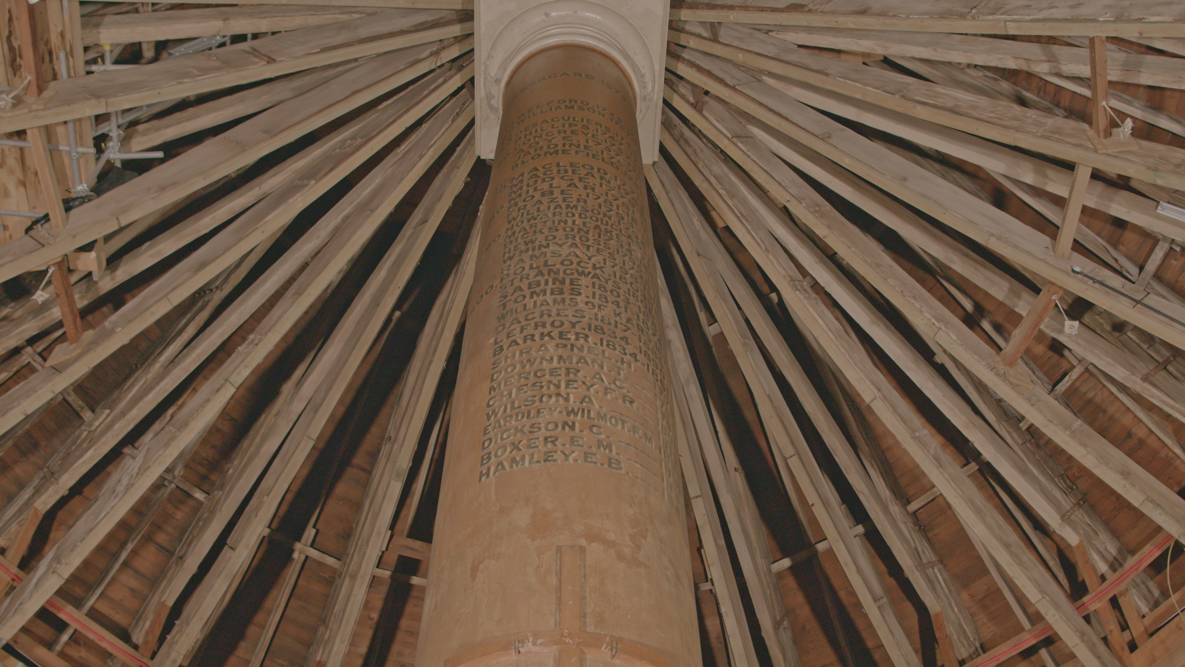 The central Doric column inside the Rotunda, viewed from below, with the names of 39 Royal Artillery officers painted on the shaft.